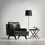 Luxury contemporary black leather armchair with stool and lamp