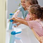 Geberit Bambini play and washspace with children playing with water