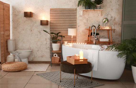 Interior_of_modern_bathroom with burning_candles_in_evening_Elements_beige_wood